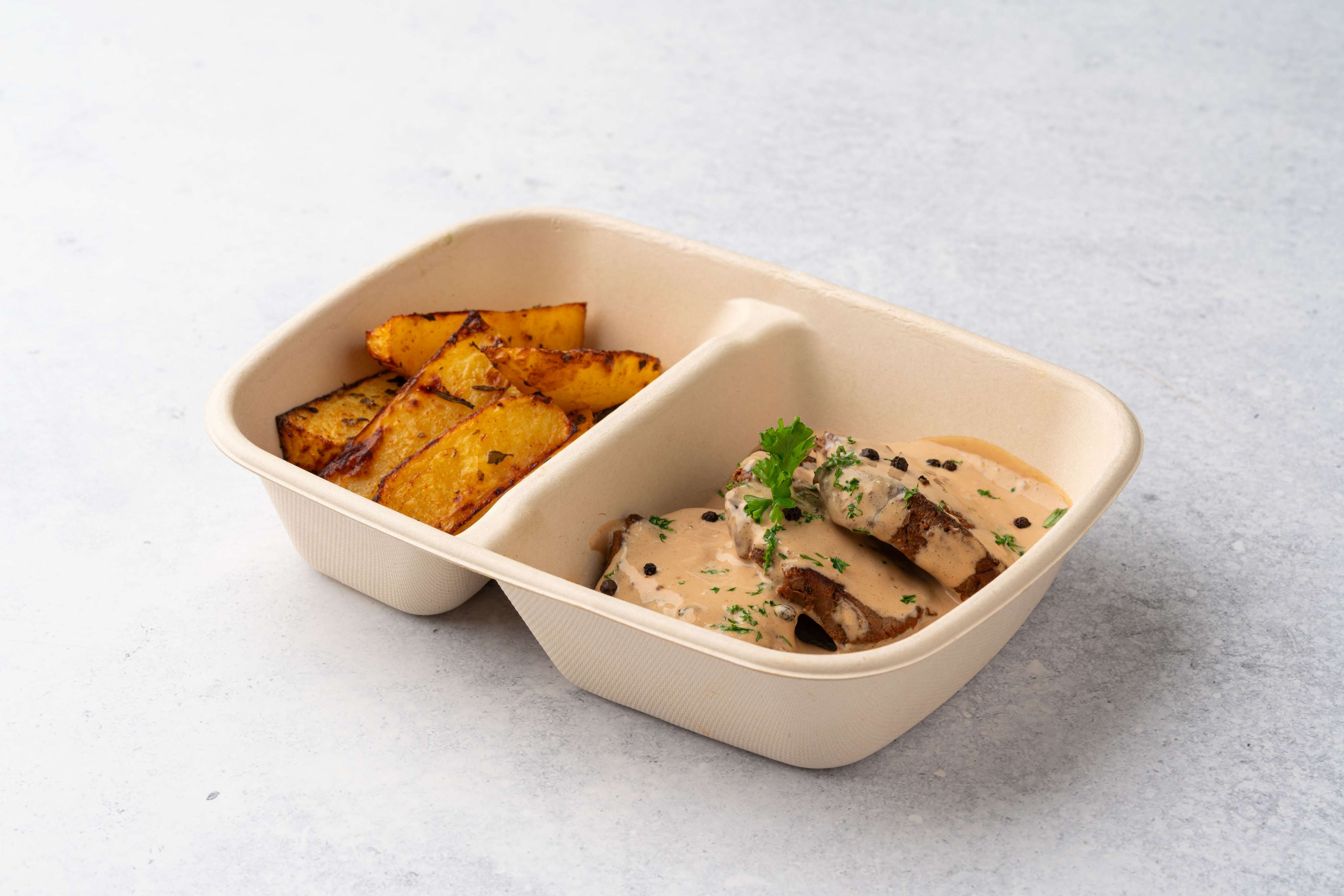 Steak With Black Pepper Sauce And Potato Wedges